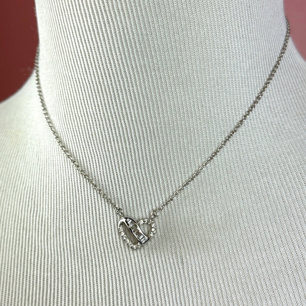 Sterling silver stamped .925 heart shaped pendant with clear stones